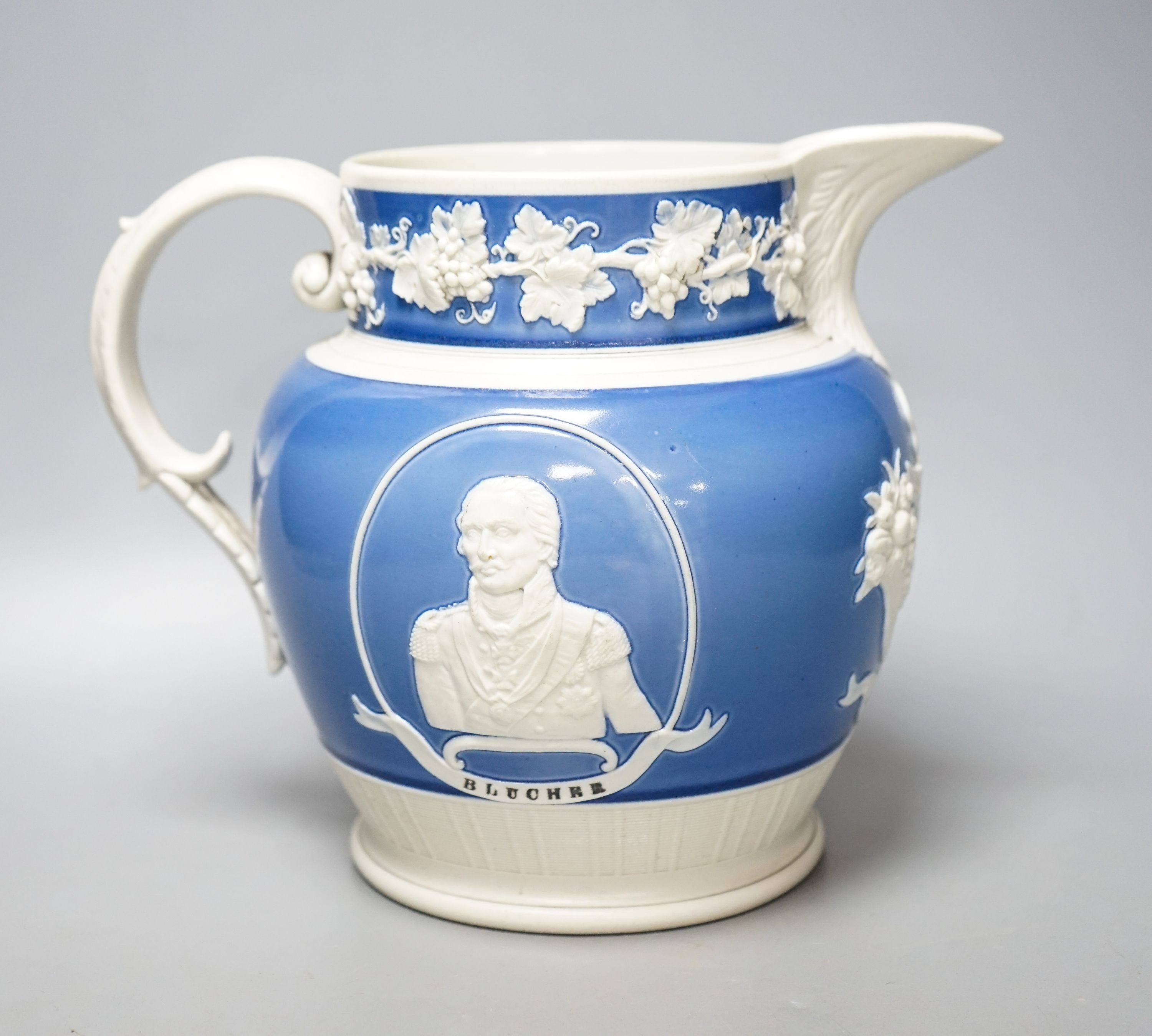 An early 19th century Wellington & Blucher commemorative peace & plenty jasper ware style jug 19cm